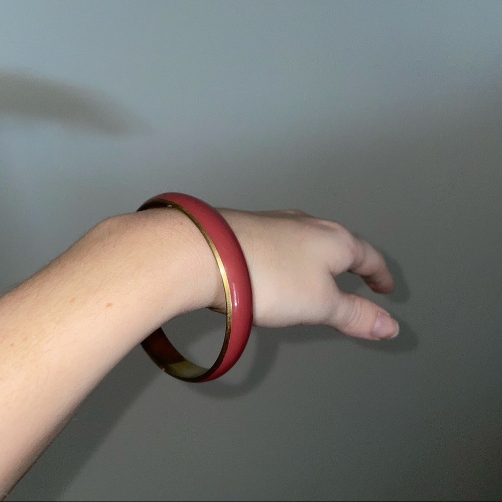 pinkish-red bangle bracelet